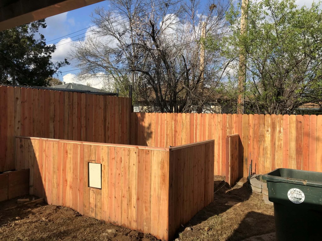 New cedar fence and enclosure in a backyard